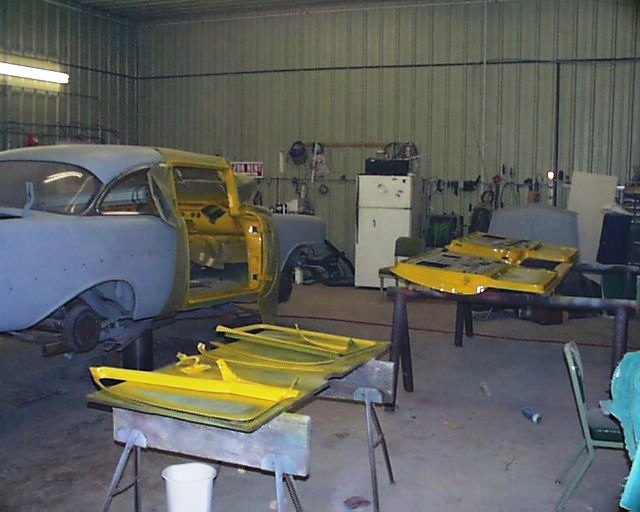 56 Chevy with parts painted yellow